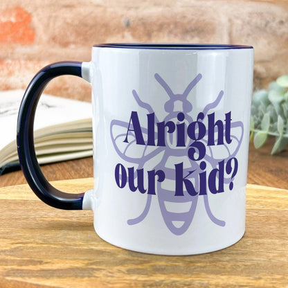 a coffee mug with the words alright and a bee on it