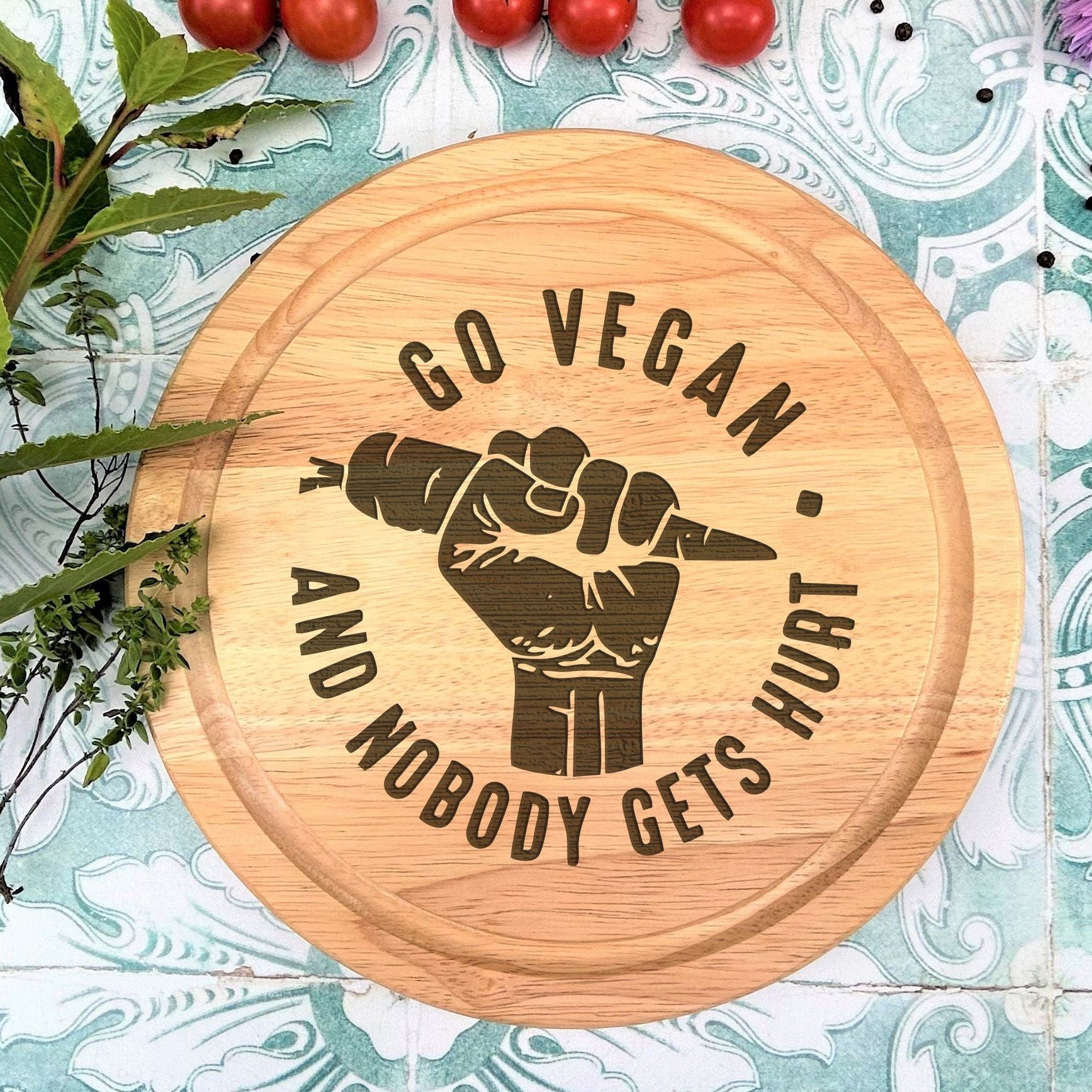 a wooden sign that says go vegan and nobody gets hurt