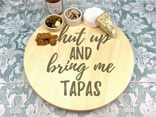 a wooden sign that says, but up and bring me tapas