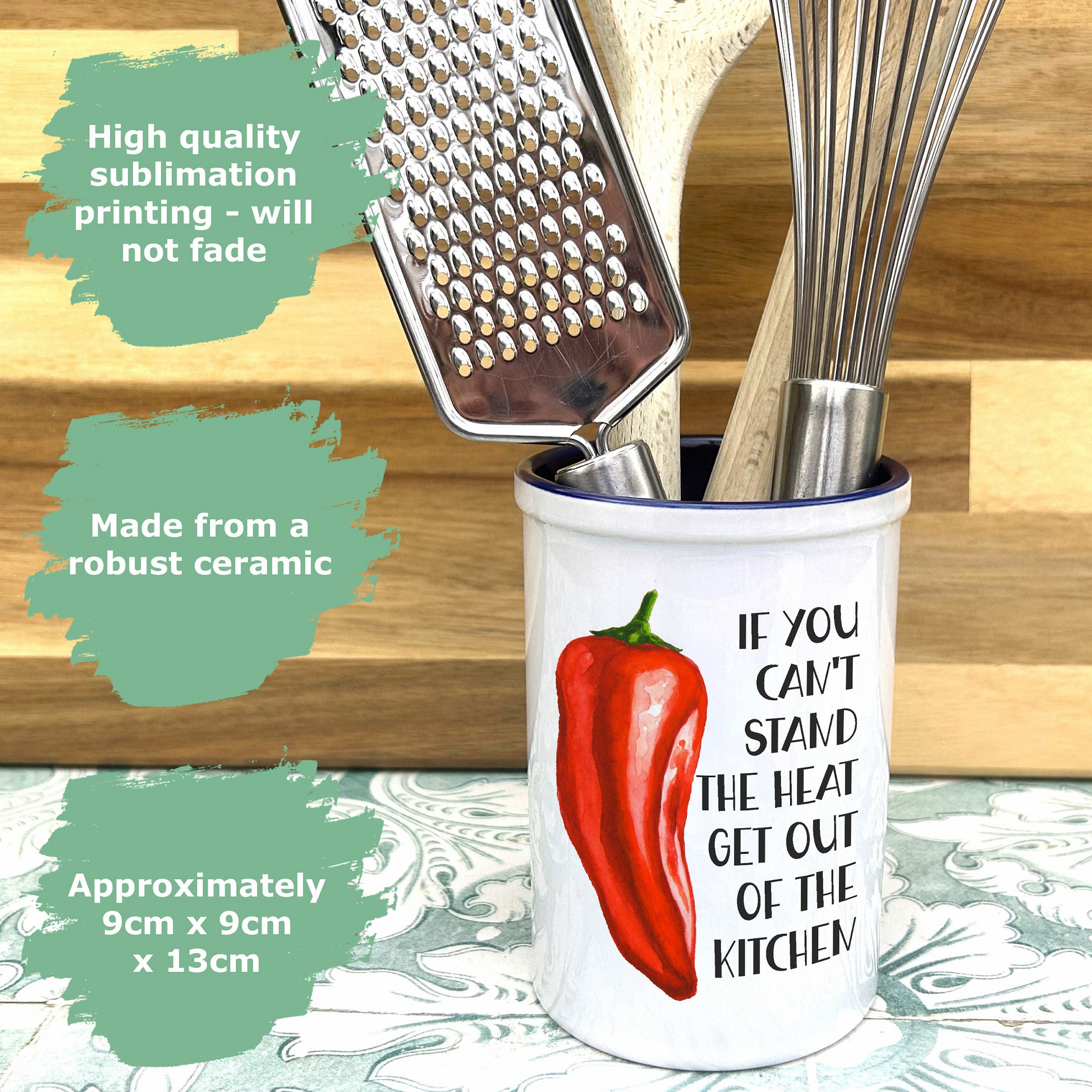 a cup with a red pepper on it and a grater in it