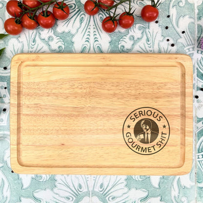 a wooden cutting board with a logo on it