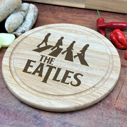 a cutting board with the words the beatles on it