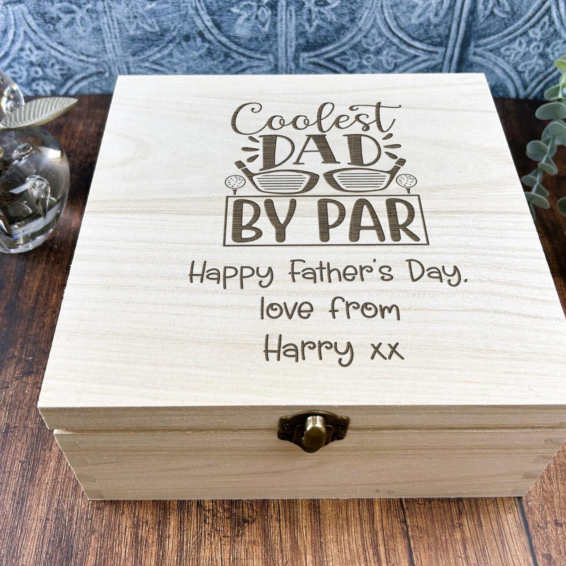 a wooden box sitting on top of a wooden table