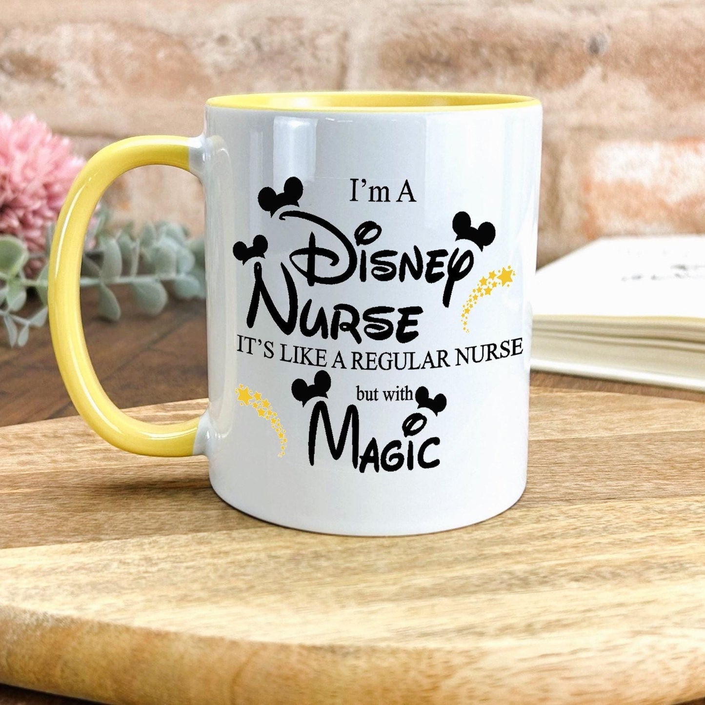 a yellow and white coffee mug sitting on top of a wooden table