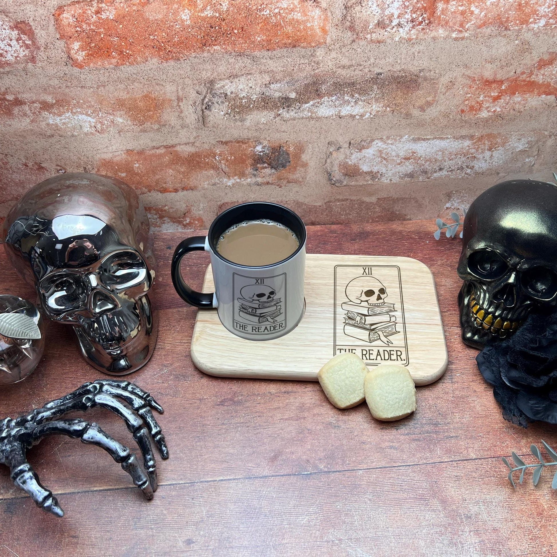 a table topped with a cup of coffee and skulls