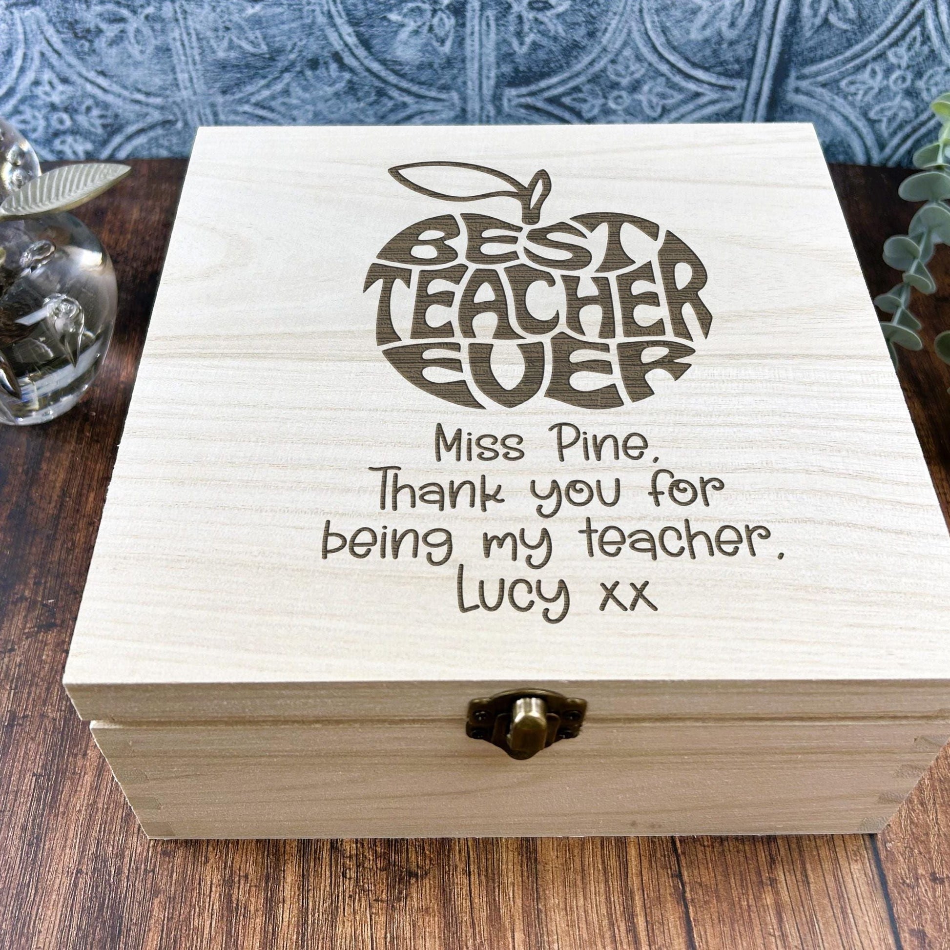 a wooden box sitting on top of a wooden table