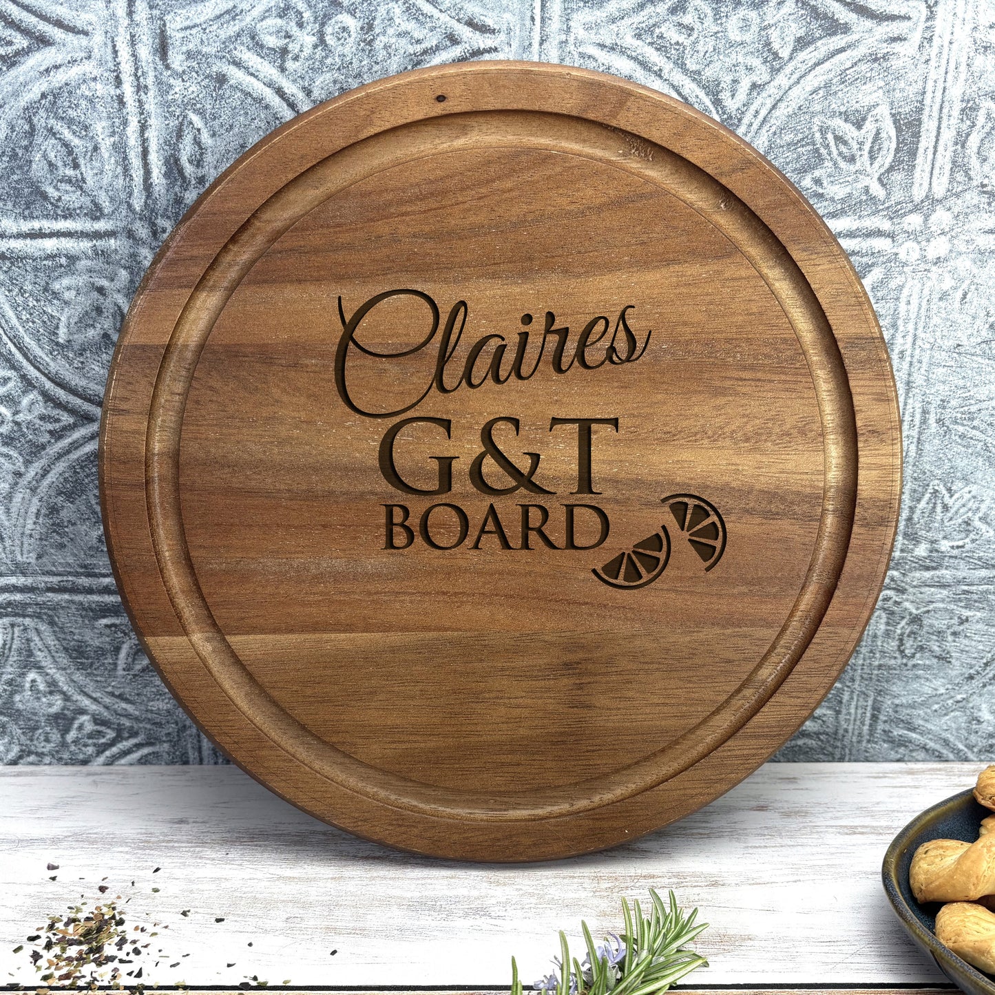 a personalized cutting board with the words g & t board engraved on it