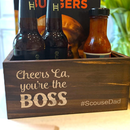 a wooden box filled with bottles of beer