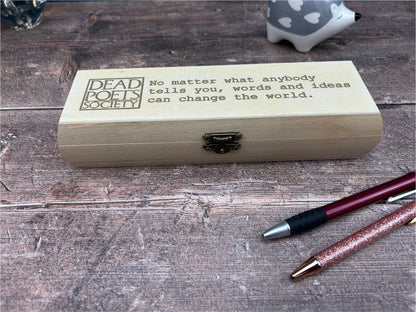 a wooden box sitting on top of a wooden table