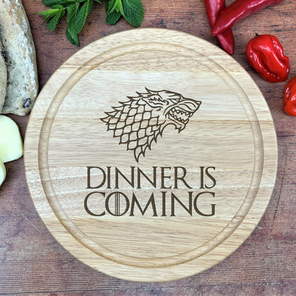 a wooden cutting board with a game of throne logo on it
