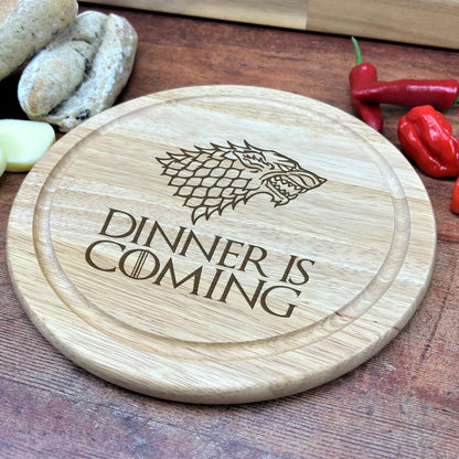 a wooden cutting board with a game of throne logo on it