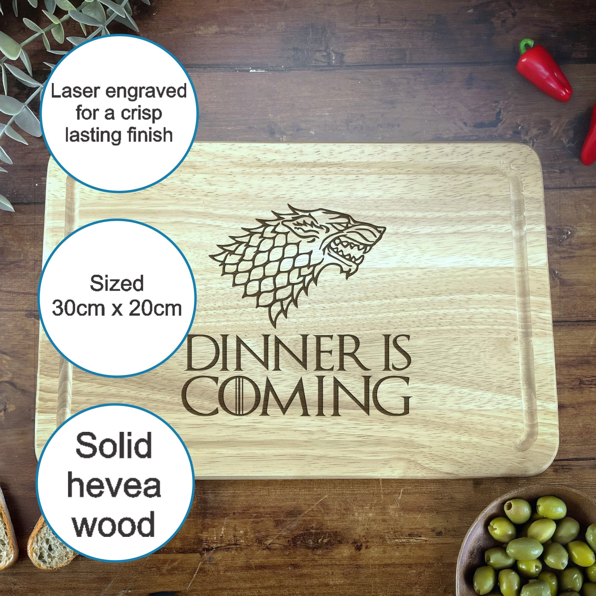 a wooden cutting board with a game of throne logo on it