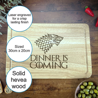 a wooden cutting board with a game of throne logo on it