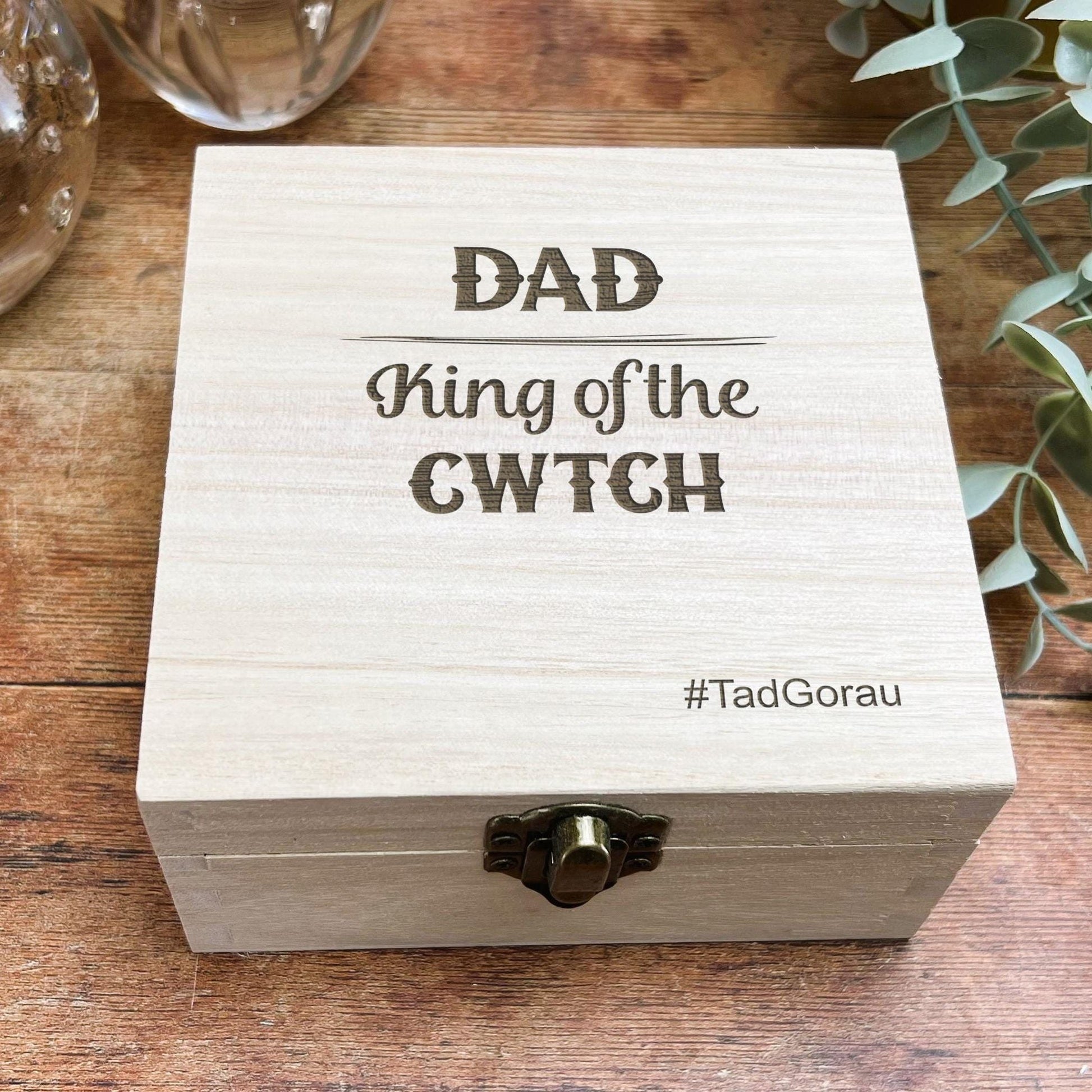 a wooden box sitting on top of a wooden table