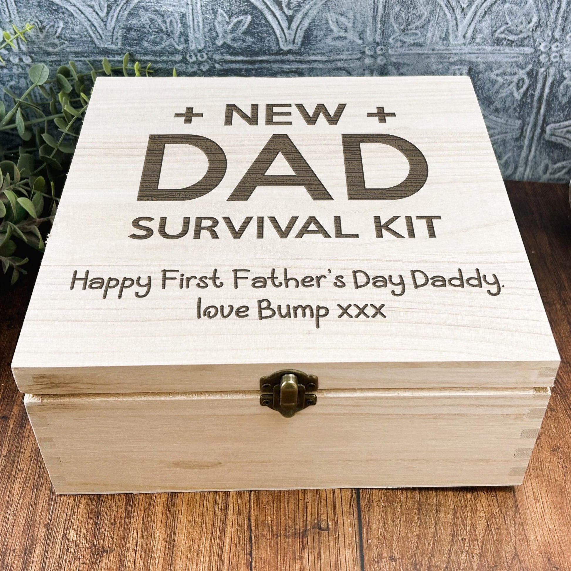 a wooden box that says, new dad survival kit
