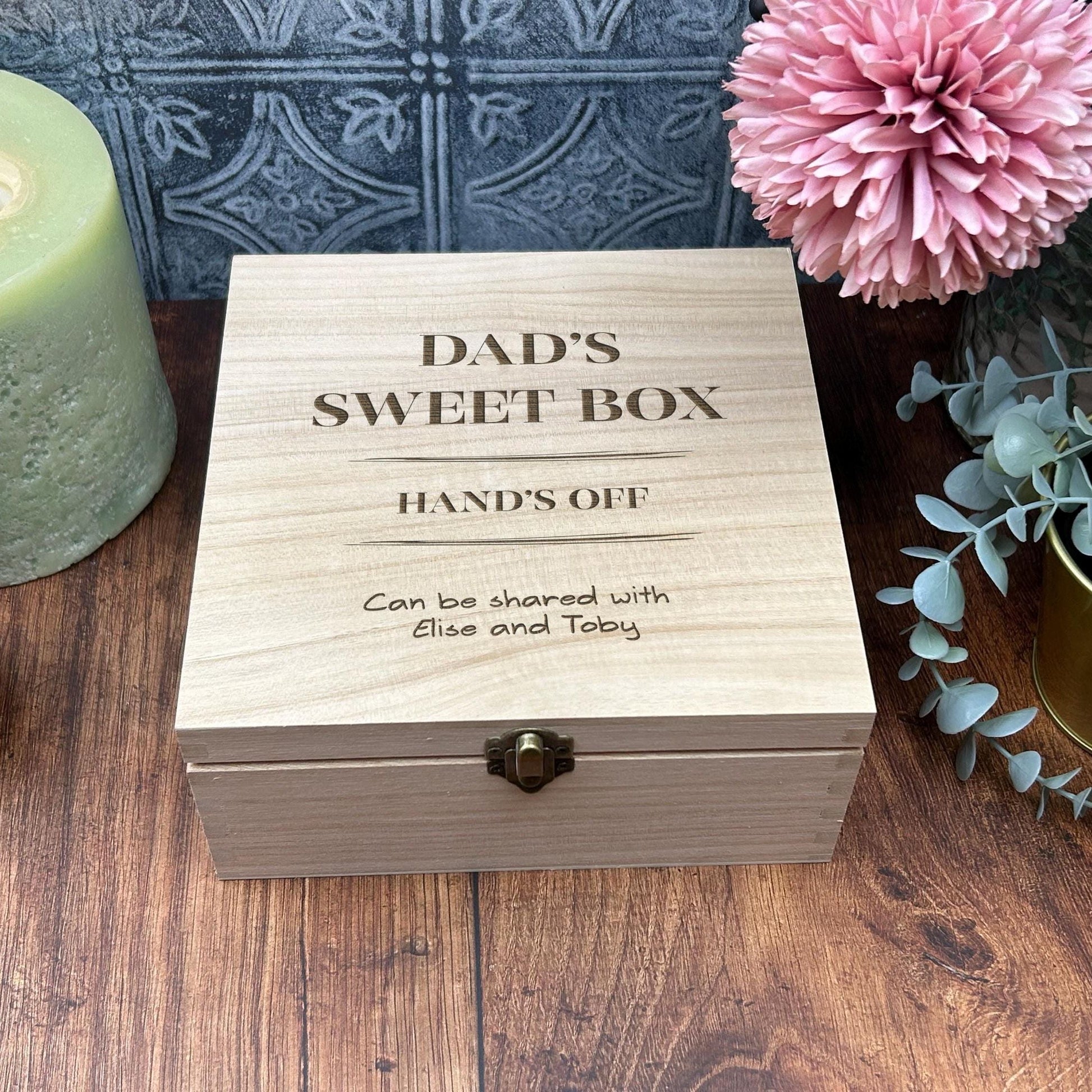 a wooden box sitting on top of a wooden table