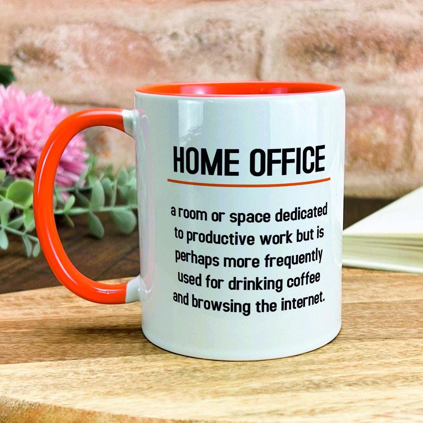 a coffee mug sitting on top of a wooden table