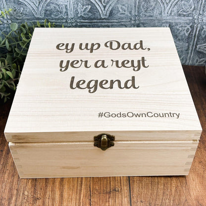a wooden box sitting on top of a wooden table
