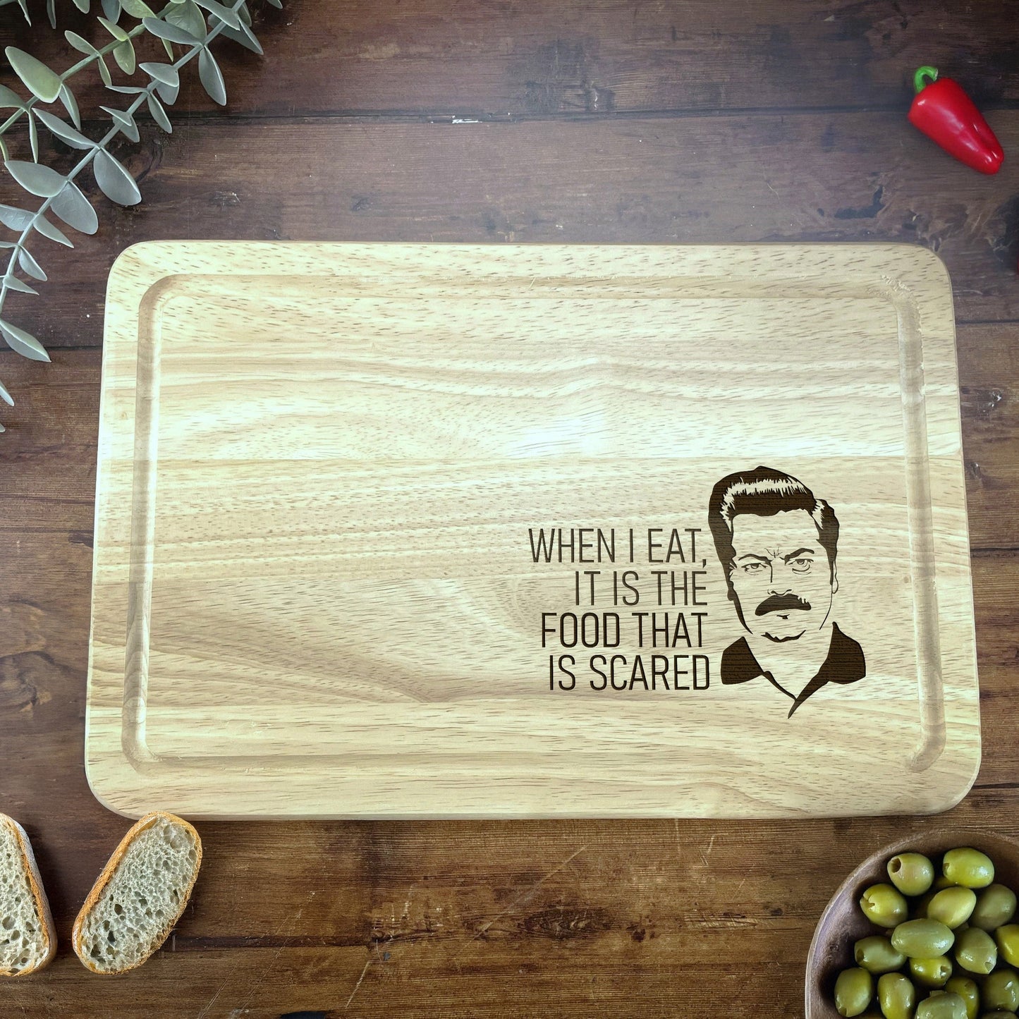 a cutting board with a picture of a man on it
