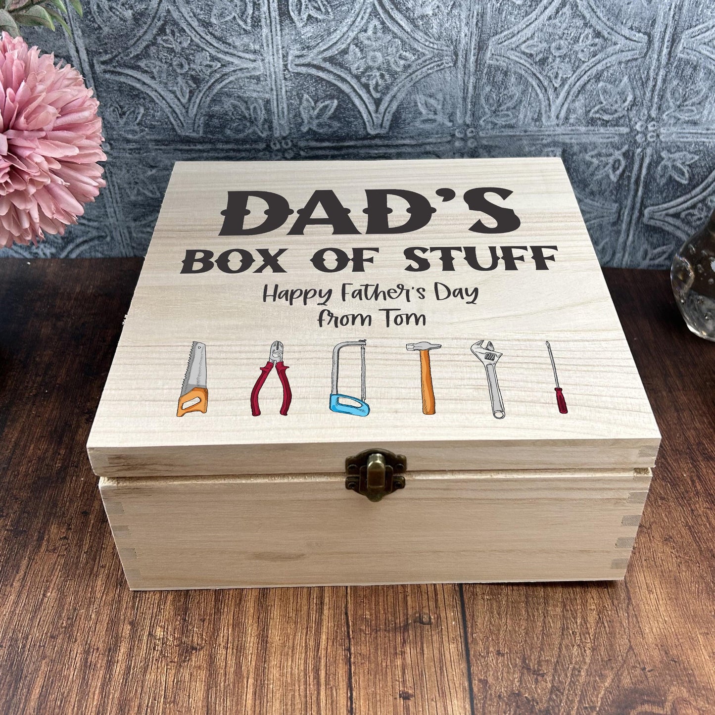 a wooden box with a picture of tools on it