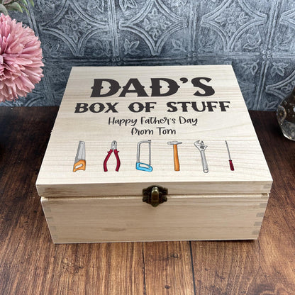 a wooden box with a picture of tools on it