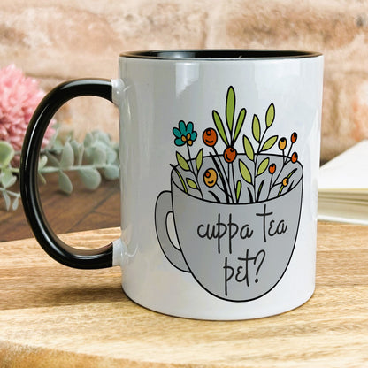 a coffee mug with a picture of flowers in it