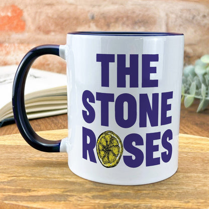 a coffee mug with the words the stone roses on it