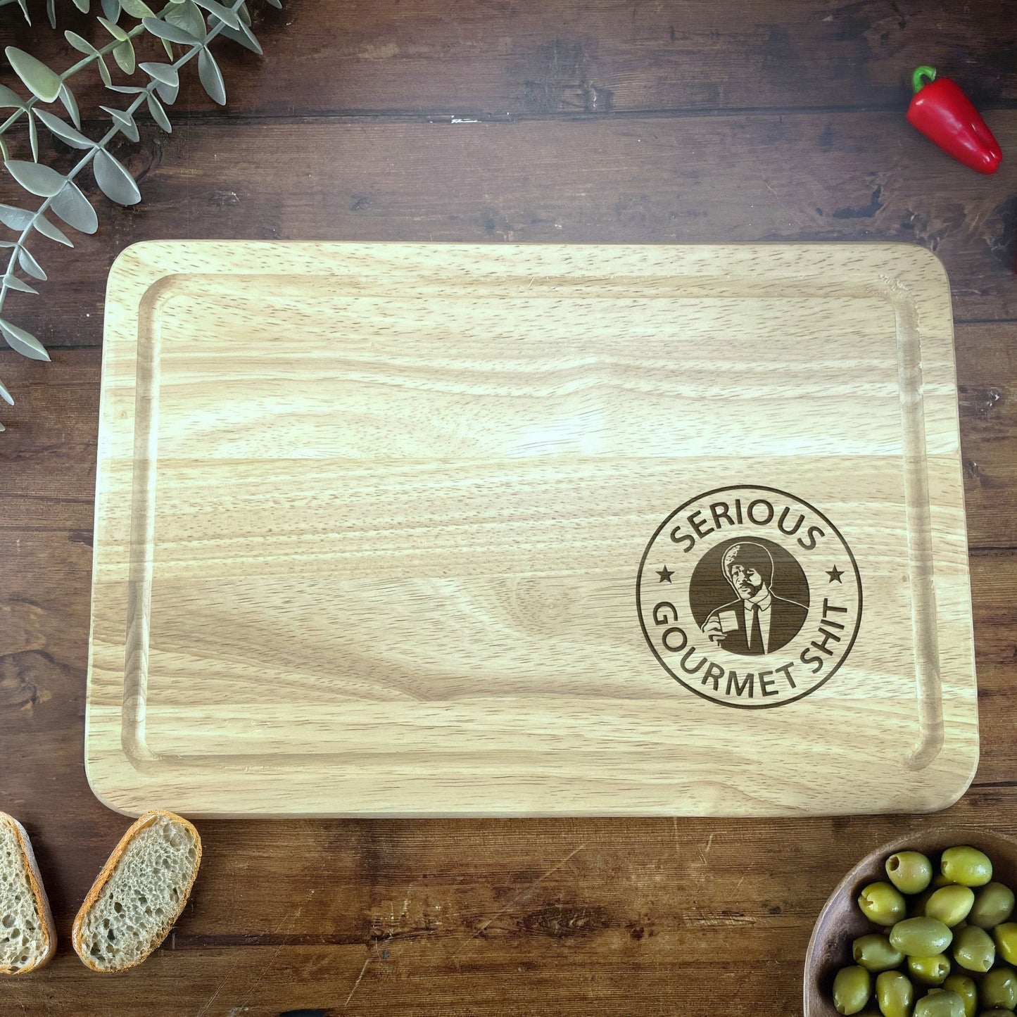 a wooden cutting board sitting on top of a wooden table
