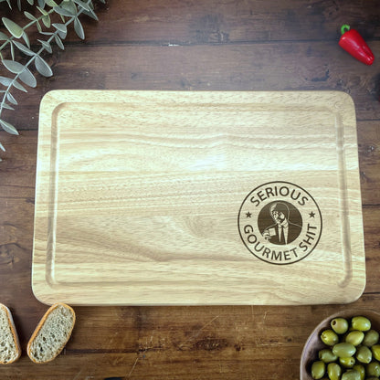 a wooden cutting board sitting on top of a wooden table