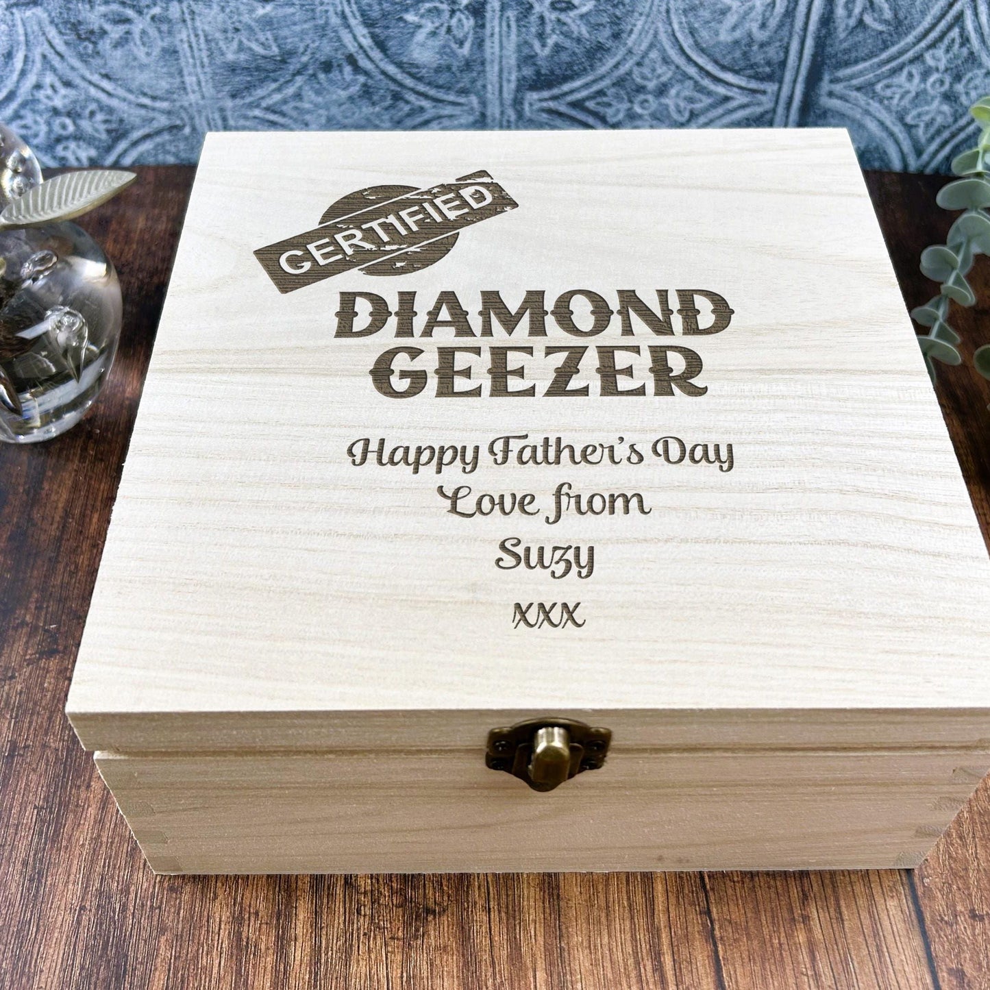 a wooden box sitting on top of a wooden table