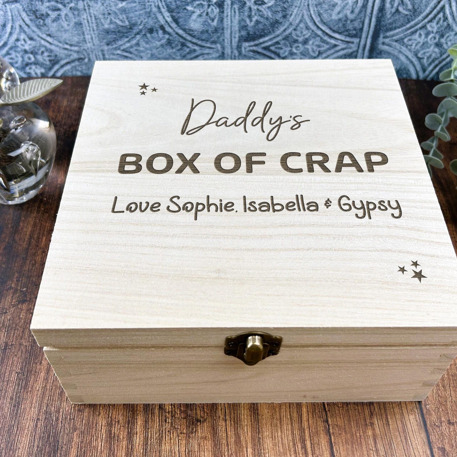a wooden box with the words daddy's box of crap on it