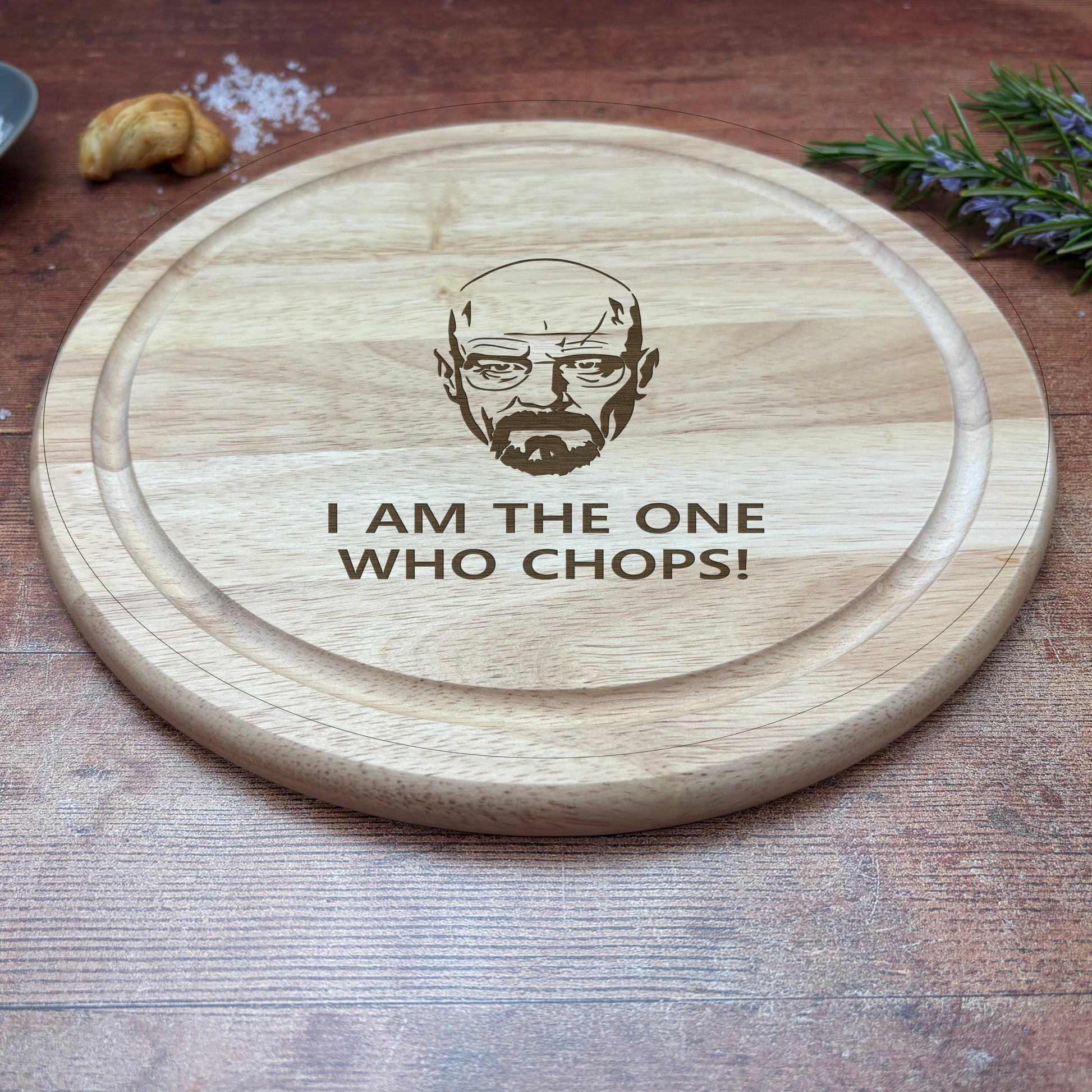 a wooden coaster with a picture of a bearded man on it