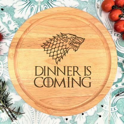 a game of thrones dinner is coming sign surrounded by tomatoes and herbs