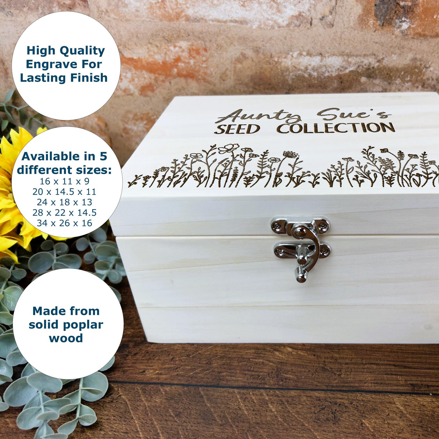 a white wooden box with a sunflower on top of it