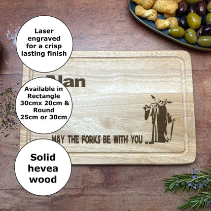 a wooden cutting board with a picture of a man holding a knife