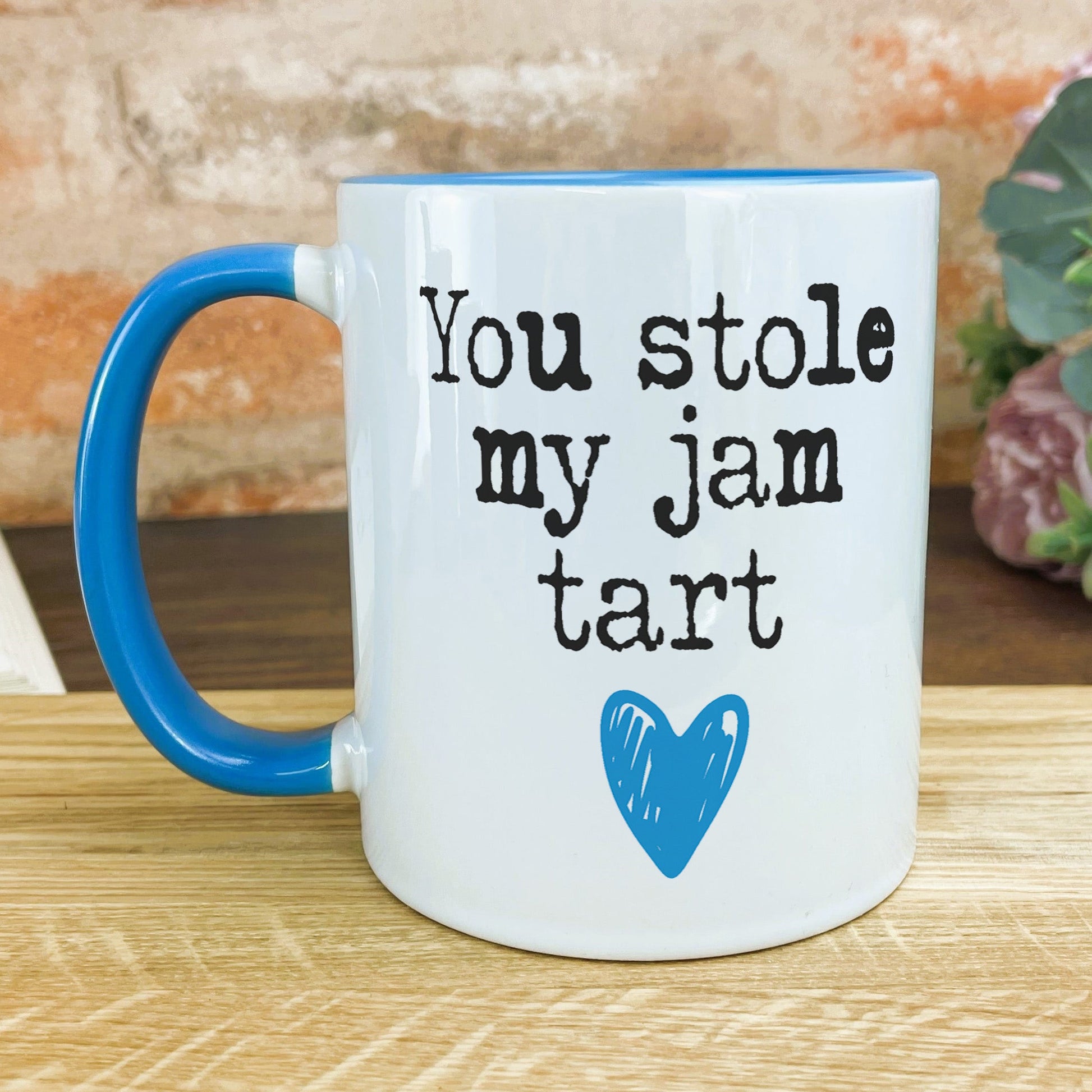 a blue and white coffee mug that says you stole my jam tart