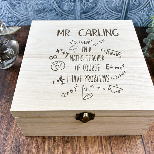 a wooden box sitting on top of a wooden table