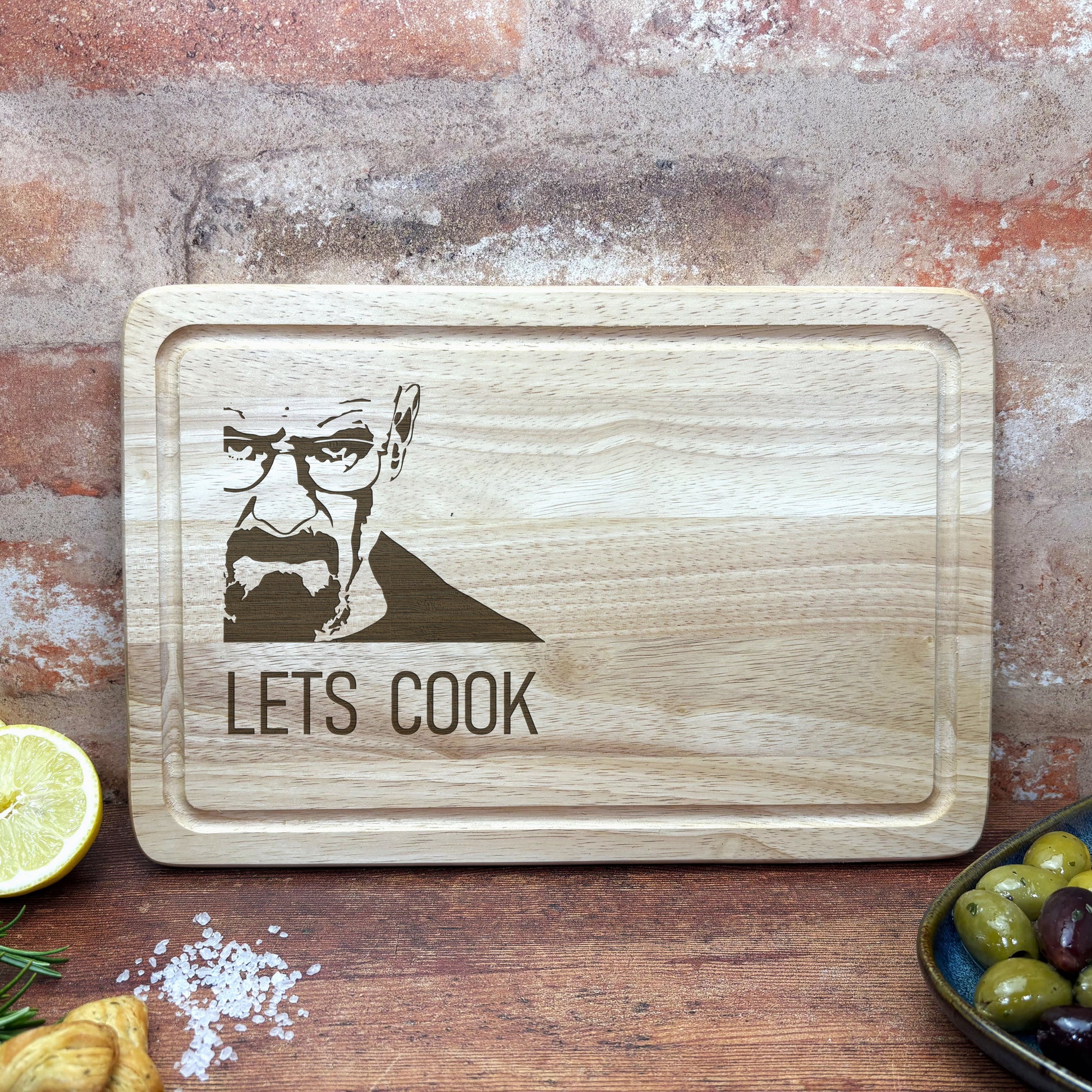 a wooden cutting board with a picture of a man on it