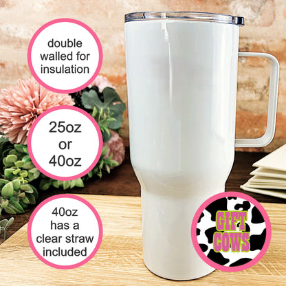 a white cup sitting on top of a wooden table