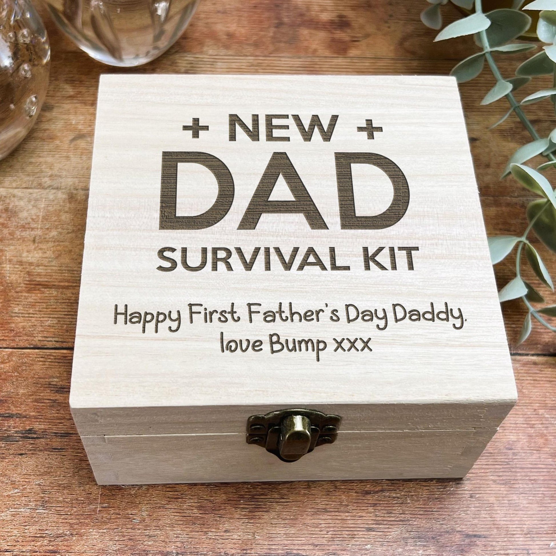 a new dad survival kit on a wooden table