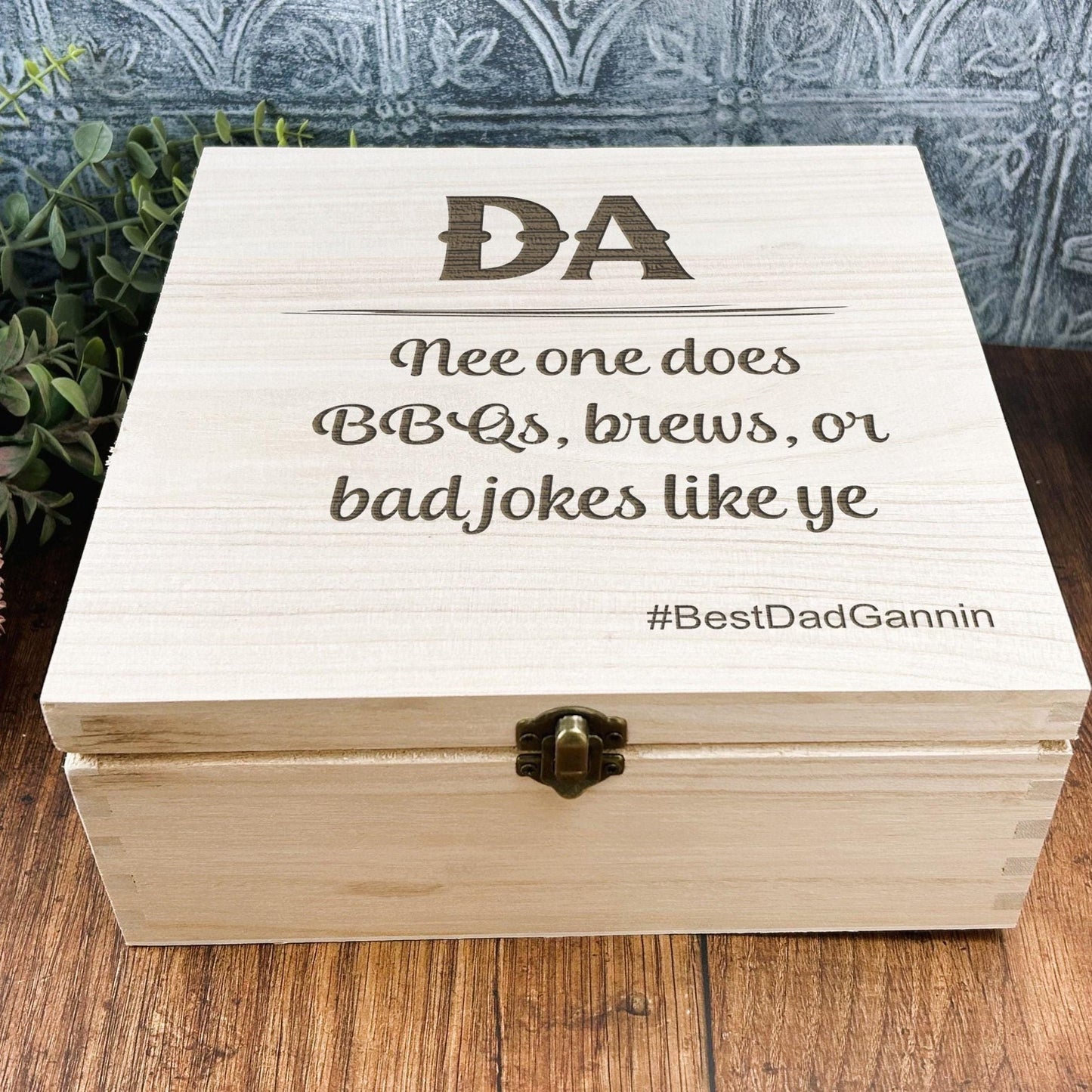 a wooden box sitting on top of a wooden table