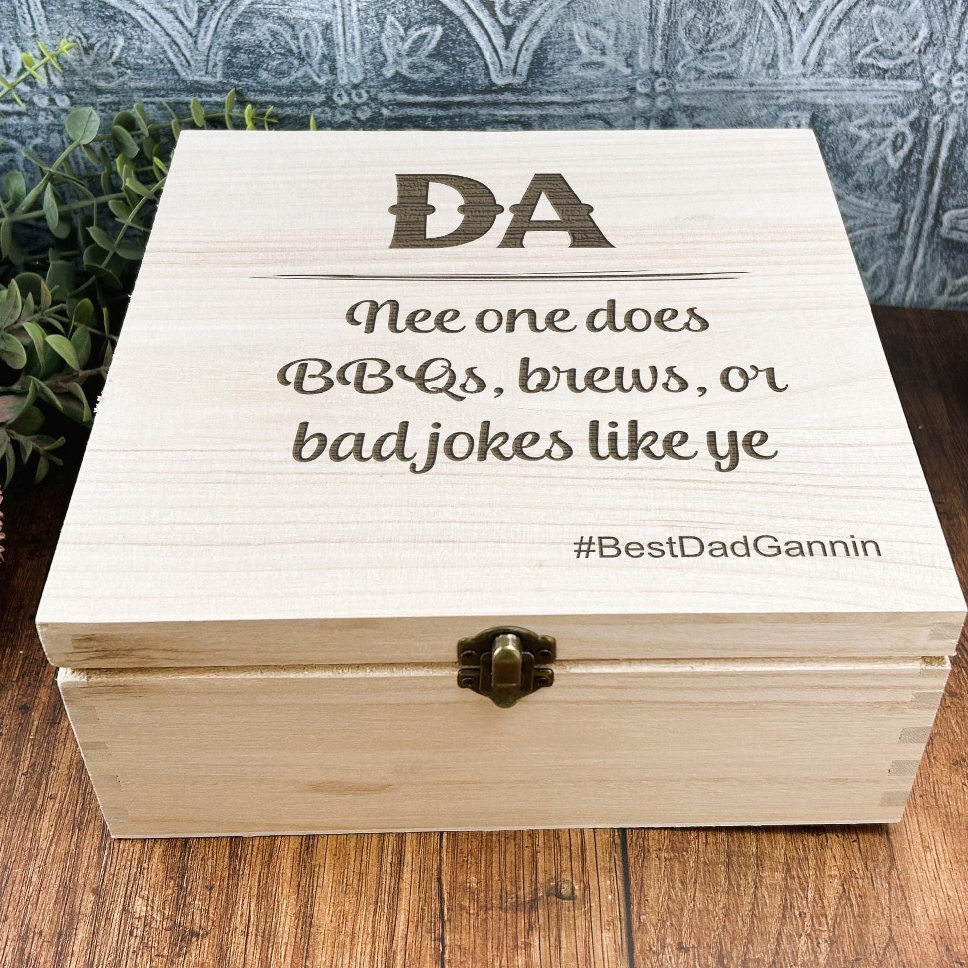 a wooden box sitting on top of a wooden table