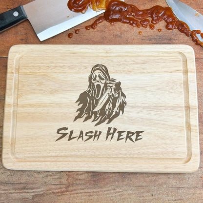 a cutting board with a picture of a ghost on it