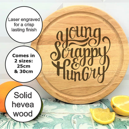 a cutting board with the words young, happy, hungry on it