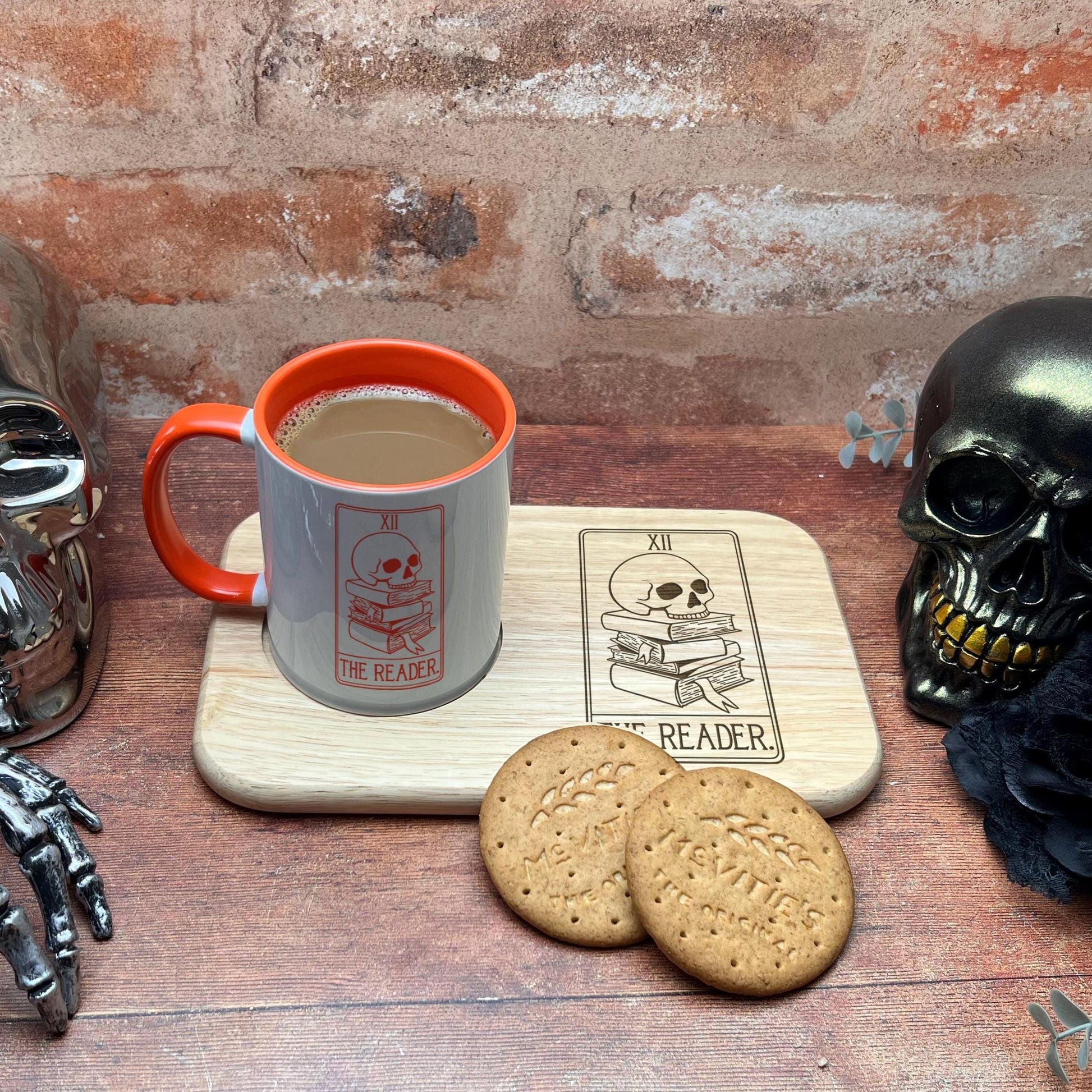 a cup of coffee and a cookie on a tray