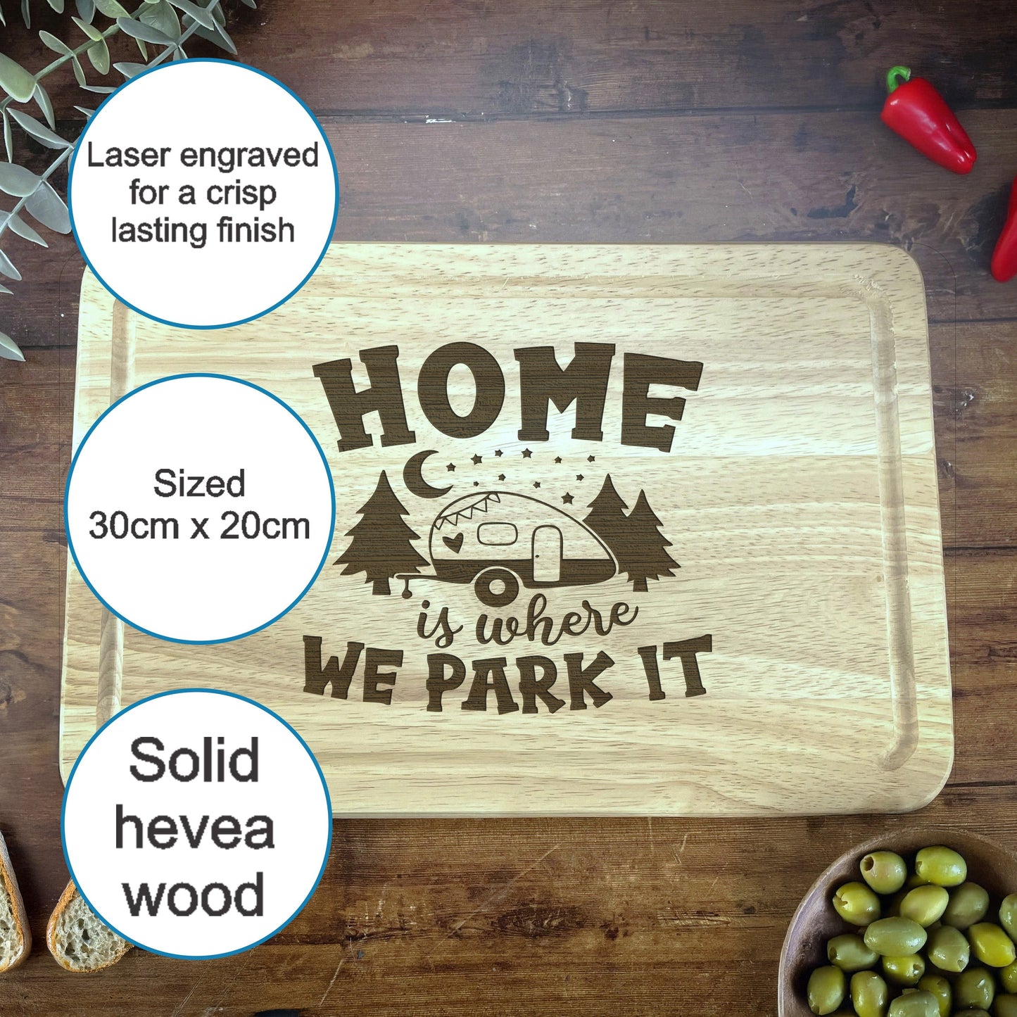 a cutting board with a picture of a camper and some olives