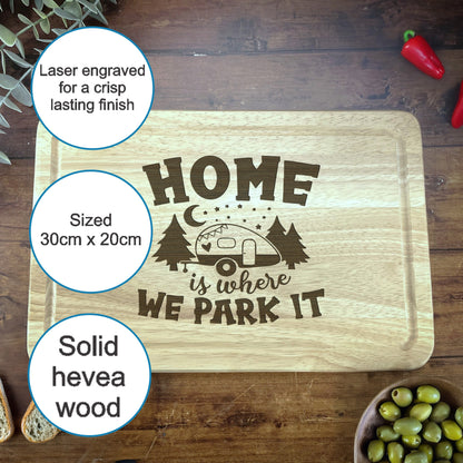 a cutting board with a picture of a camper and some olives