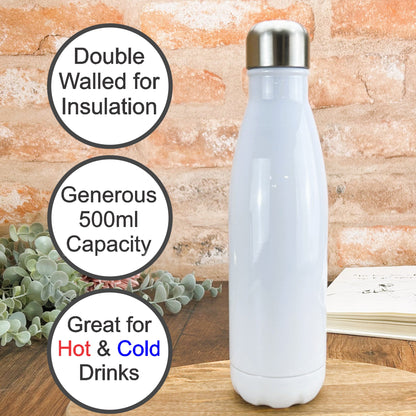 a white water bottle sitting on top of a wooden table