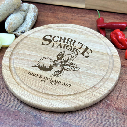 a wooden cutting board with a logo on it