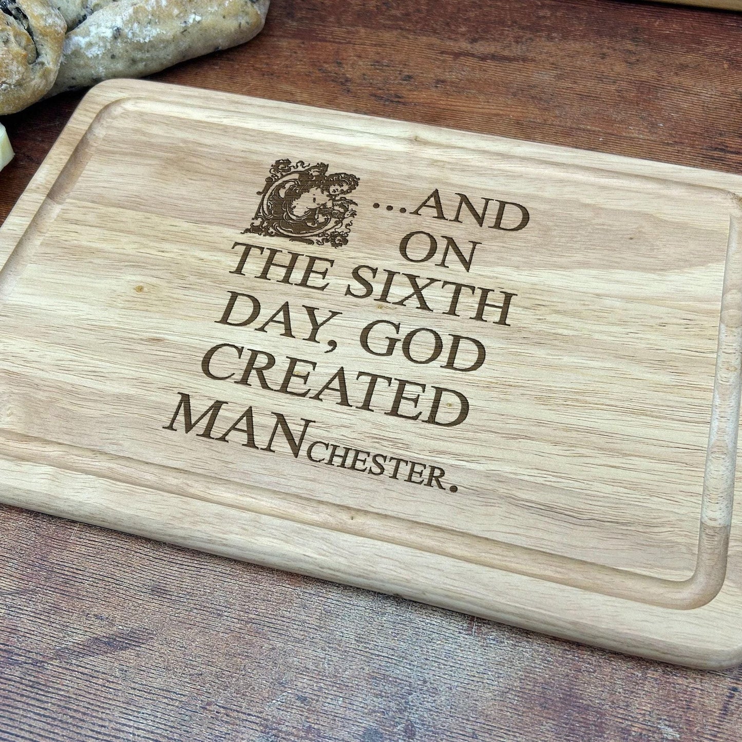 And On The Sixth Day God Created MANchester - Engraved Wooden Chopping Board